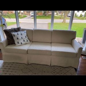 2 beige sofas, seats 6 people.